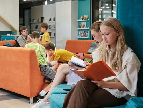 Children reading at a library