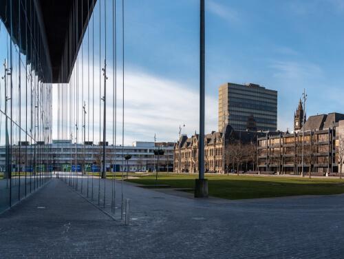 The glass windows of the MIMA Gallery and the buildings opposite