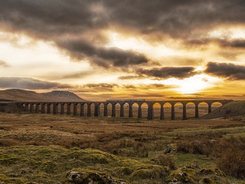 Arches of the Ribblehead Viaduct in the Yorkshire Dales at sunset